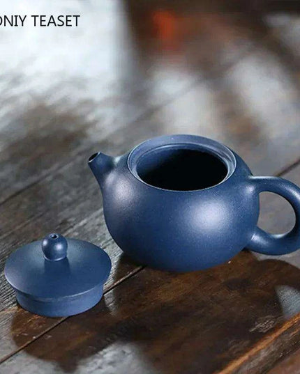 Elegant Yixing Purple Clay Teapot – 100ml with Unique Ball Filter for Authentic Zisha Tea Experience