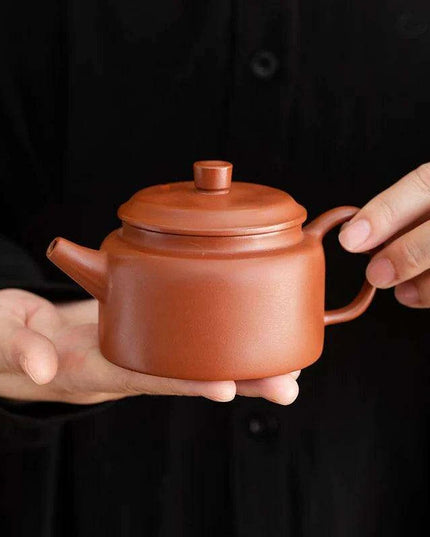 Authentic Artisan Yixing Purple Clay Teapot with Built-In Strainer for a Premium Puer Tea Experience