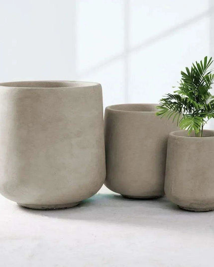 Contemporary Round Concrete Planter Collection with Drainage for Stylish Environments