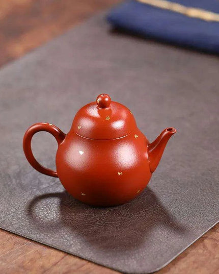 Elegant Purple Clay Teapot with Golden Accents for Refined Tea Enjoyment