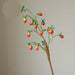 Festive Red Pomegranate Floral Branch with Lush Greenery