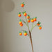 Festive Red Pomegranate Floral Branch with Lush Greenery