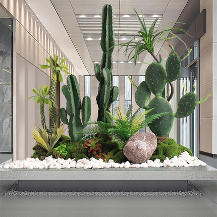 The Space Under The Staircase Is Decorated with Simulated Green Plants in The Desert Creating Indoor Micro-landscape the-space-under-the-staircase-is-decorated-with-simulated-green-plants-in-the-desert-creating-indoor-micro-landscape