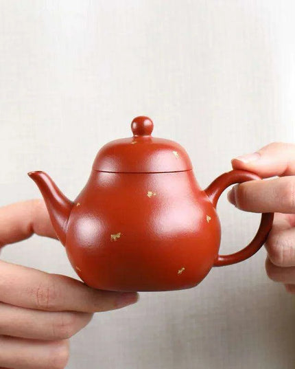 Elegant Purple Clay Teapot with Golden Accents for Refined Tea Enjoyment
