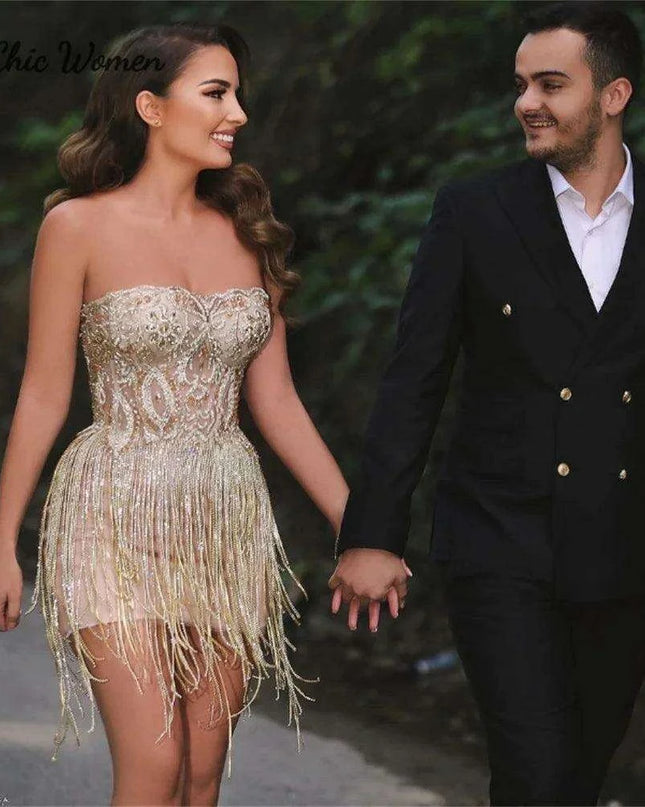 Elegant Champagne Strapless Gown with Crystal Accents and Trendy Tassels