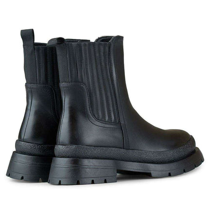 Sleek Eco-Friendly Black Leather Ankle Boots for Effortless Style - Très Elite