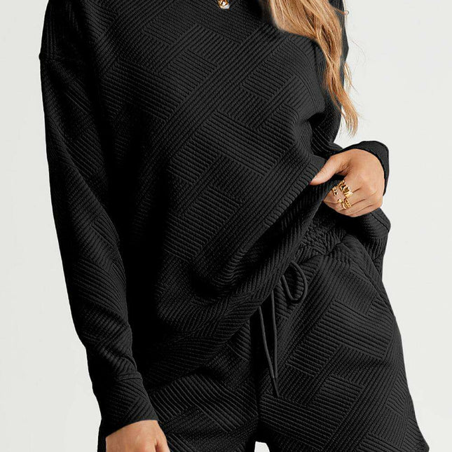 Sophisticated Black Textured Lounge Set with Long Sleeve Top and Adjustable Shorts