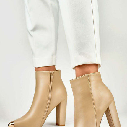 Sophisticated Stiletto Booties with Glamorous Metal Detailing - Très Elite