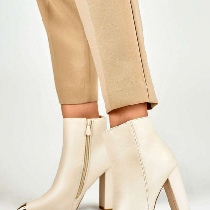 Sophisticated Stiletto Booties with Glamorous Metal Detailing - Très Elite
