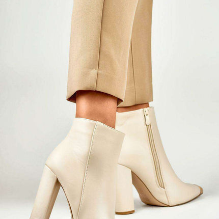 Sophisticated Stiletto Booties with Glamorous Metal Detailing - Très Elite