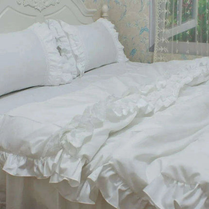 Sophisticated White Cotton Bedding Collection with Lace Detailing and Embroidered Trimmings..