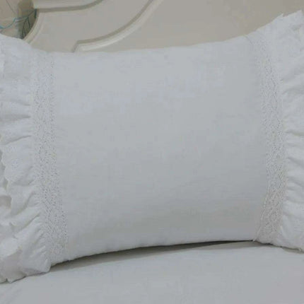 Sophisticated White Cotton Bedding Collection with Lace Detailing and Embroidered Trimmings..