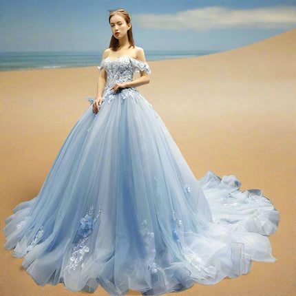 Stunning Off-The-Shoulder Cerulean Quinceanera Ball Gown with Graceful Lace Details and Dramatic Train - Très Elite