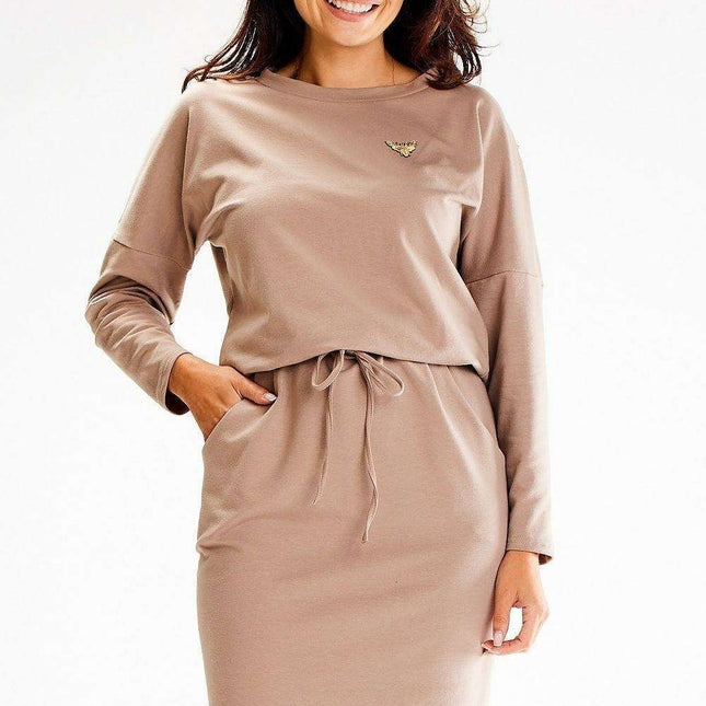 Stylish Cotton Daydress with Adjustable Tie, Convenient Pockets, and Distinct Applique Accents