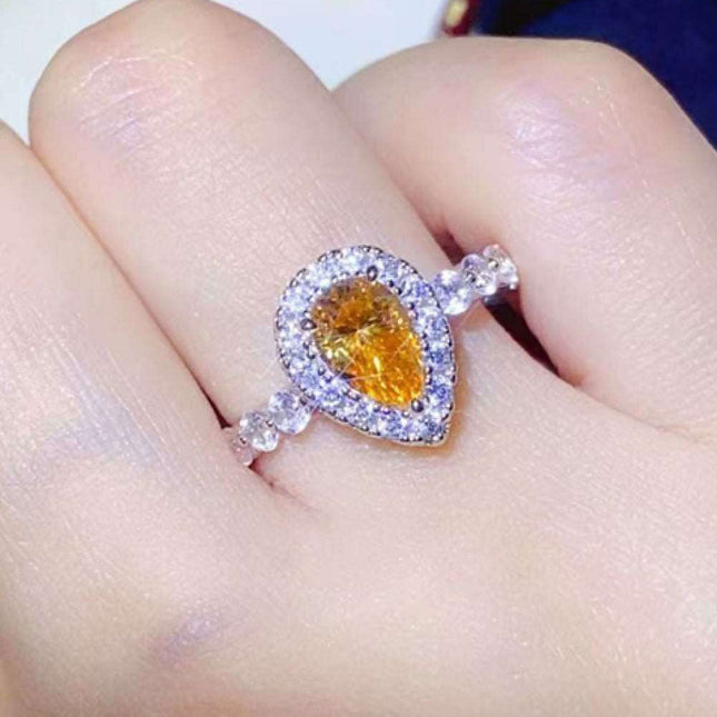 Timeless Teardrop Moissanite Ring with Sparkling Zircon Accents - A Blend of Elegance and Craftsmanship