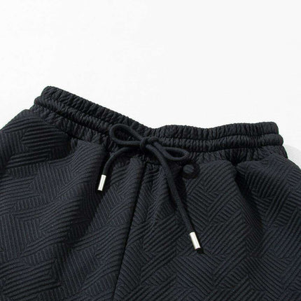 Chic Black Flutter Sleeve Top and Wide-Leg Trousers Ensemble