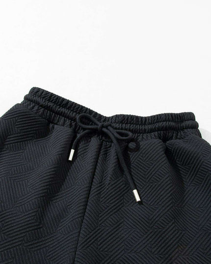 Chic Black Flutter Sleeve Top and Wide-Leg Trousers Ensemble