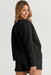 Sophisticated Black Textured Lounge Set with Long Sleeve Top and Drawstring Shorts