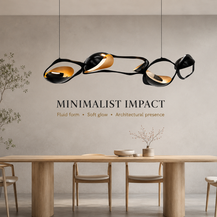 A modern multi-light linear pendant chandelier with black and gold reflective curves, suspended over a minimalist dining table in a warm, modern interior setting.