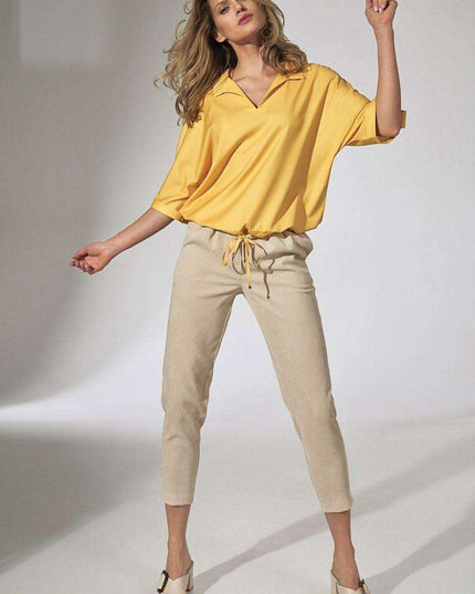 Chic Beige Corduroy Trousers with Elegant Pleats and Tapered Fit