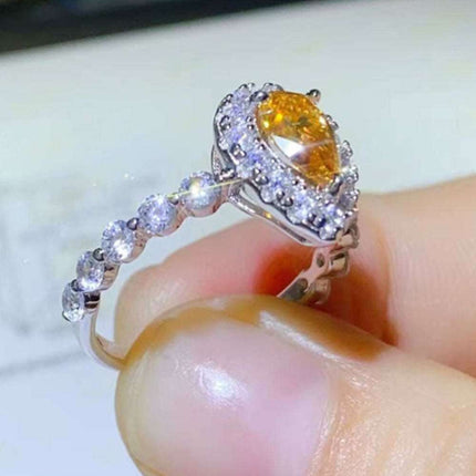 Timeless Teardrop Moissanite Ring with Sparkling Zircon Accents - A Blend of Elegance and Craftsmanship