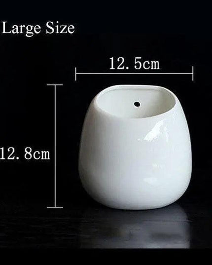 Tranquil Haven Ceramic Plant Hanger: Infuse Your Home with Greenery