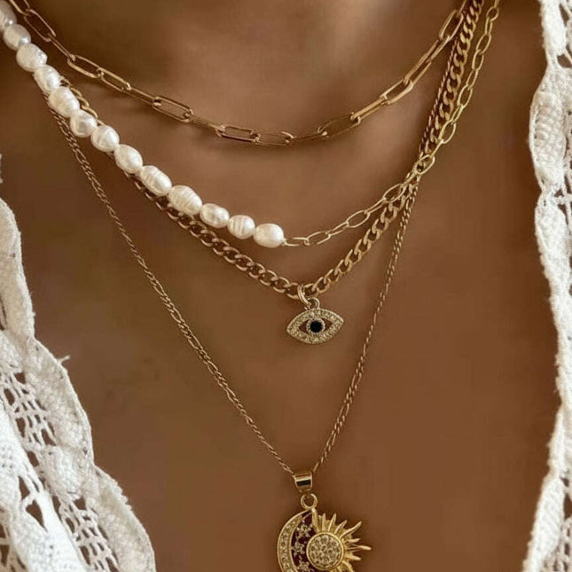 Gold-Plated Multi-Layer Pearl & Eye Necklace – Modern Statement Jewelry