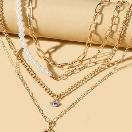 Gold-Plated Multi-Layer Pearl & Eye Necklace – Modern Statement Jewelry