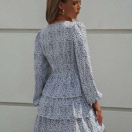 Charming Polka Dot V-Neck Dress with Puff Sleeves and Waist-Defining Style