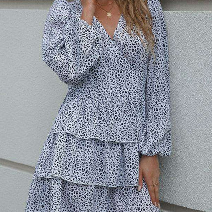 Charming Polka Dot V-Neck Dress with Puff Sleeves and Waist-Defining Style