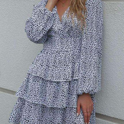 Charming Polka Dot V-Neck Dress with Puff Sleeves and Waist-Defining Style