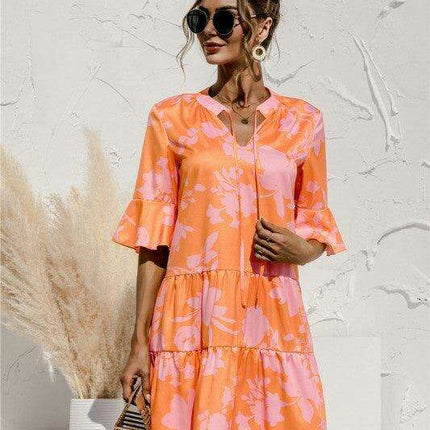 Enchanting Floral V-Neck Maxi Dress with Elegant Trumpet Sleeves and Delightful Cake Accents