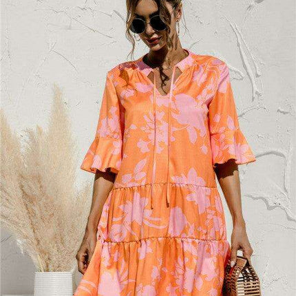 Enchanting Floral V-Neck Maxi Dress with Elegant Trumpet Sleeves and Delightful Cake Accents