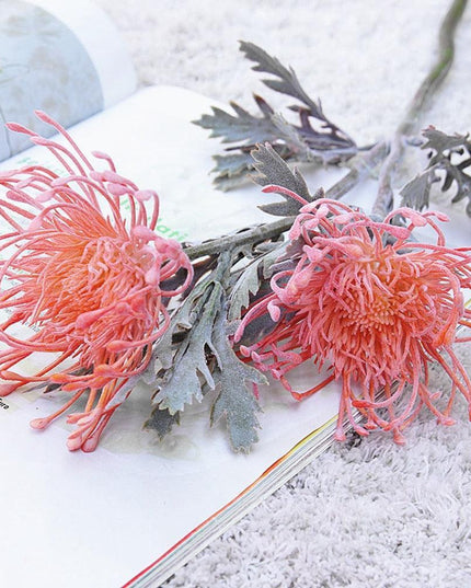 Elegant Crab Claw Floral Arrangement with Festive Garland Vase