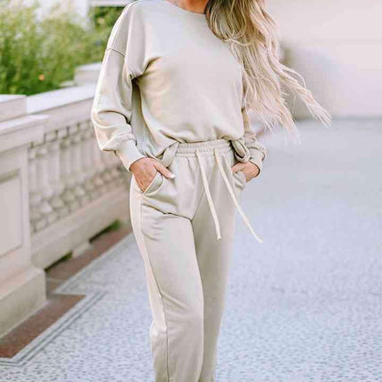 Cozy Chic Lounge Ensemble with Trendy Drop Shoulder Top and Convenient Pocketed Pants
