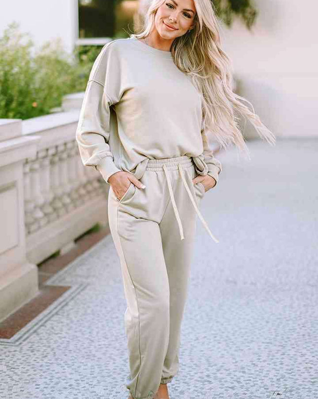Cozy Chic Lounge Ensemble with Trendy Drop Shoulder Top and Convenient Pocketed Pants