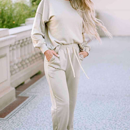 Cozy Chic Lounge Ensemble with Trendy Drop Shoulder Top and Convenient Pocketed Pants