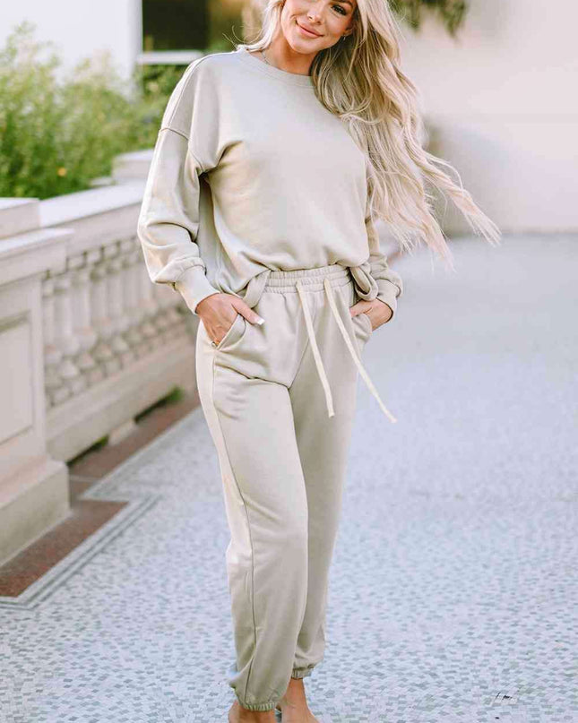 Cozy Chic Lounge Ensemble with Trendy Drop Shoulder Top and Convenient Pocketed Pants