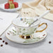 Elegant Pair of Bone China Tea Cups and Saucers with Delicate Details.