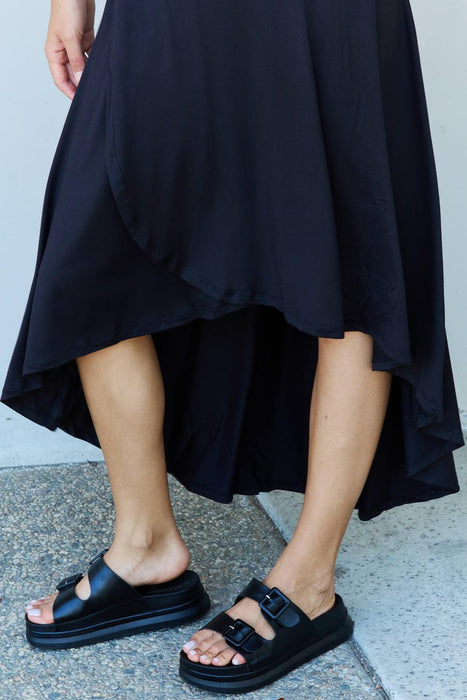 Elegant Black High-Rise Flared Maxi Skirt with Asymmetrical Hemline by Ninexis