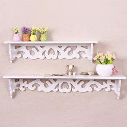 Chic White Carved Wood Wall Shelf with Unique Hollow Design for Organized Living Spaces