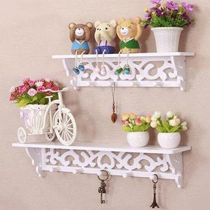 Chic White Carved Wood Wall Shelf with Unique Hollow Design for Organized Living Spaces
