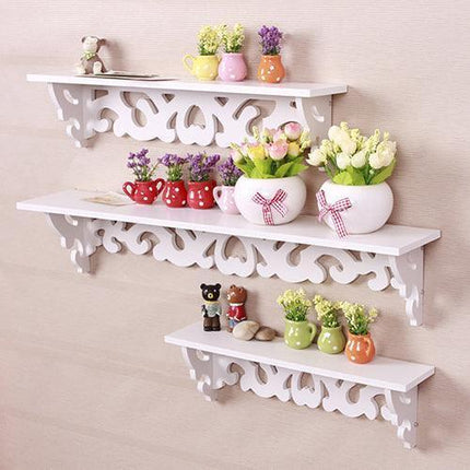 Chic White Carved Wood Wall Shelf with Unique Hollow Design for Organized Living Spaces