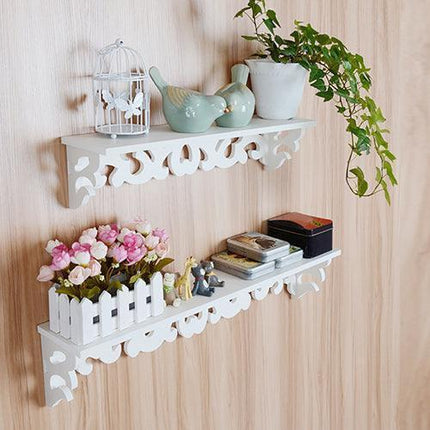 Chic White Carved Wood Wall Shelf with Unique Hollow Design for Organized Living Spaces