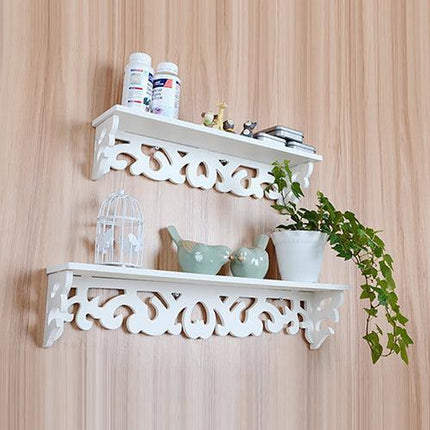 Chic White Carved Wood Wall Shelf with Unique Hollow Design for Organized Living Spaces
