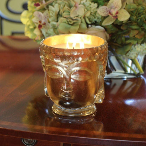 Golden Buddha Head Candle: Opulent 24K Gold Glass with Ambrette and Sandalwood Fragrance