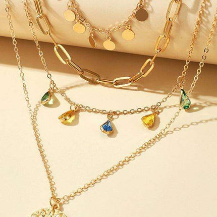Chic Layered Necklace with Rhinestone Tassel and Geometric Discs - Très Elite