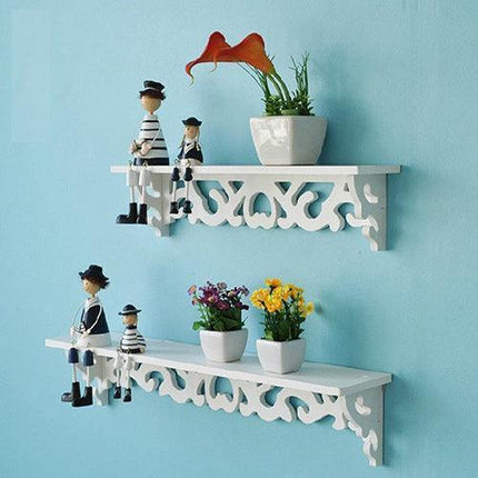 Chic White Carved Wood Wall Shelf with Unique Hollow Design for Organized Living Spaces