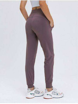 Chic and Functional: Trendy Tied Joggers with Versatile Pockets - Très Elite