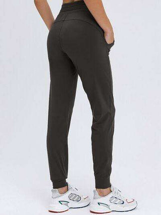 Chic and Functional: Trendy Tied Joggers with Versatile Pockets - Très Elite